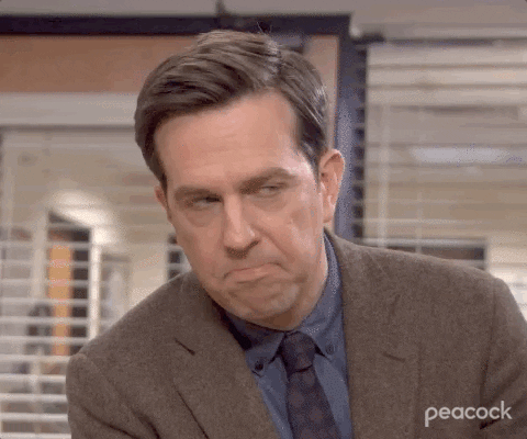 The Office gif. Ed Helms as Andy Bernard shakes his head while frowning, as if to say, nah.
